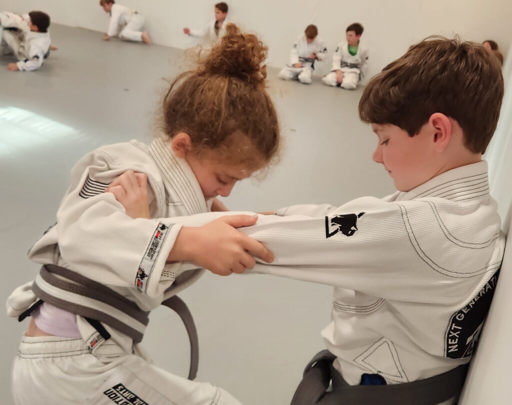 Youth martial arts in Thibodaux practicing focus and discipline during class
