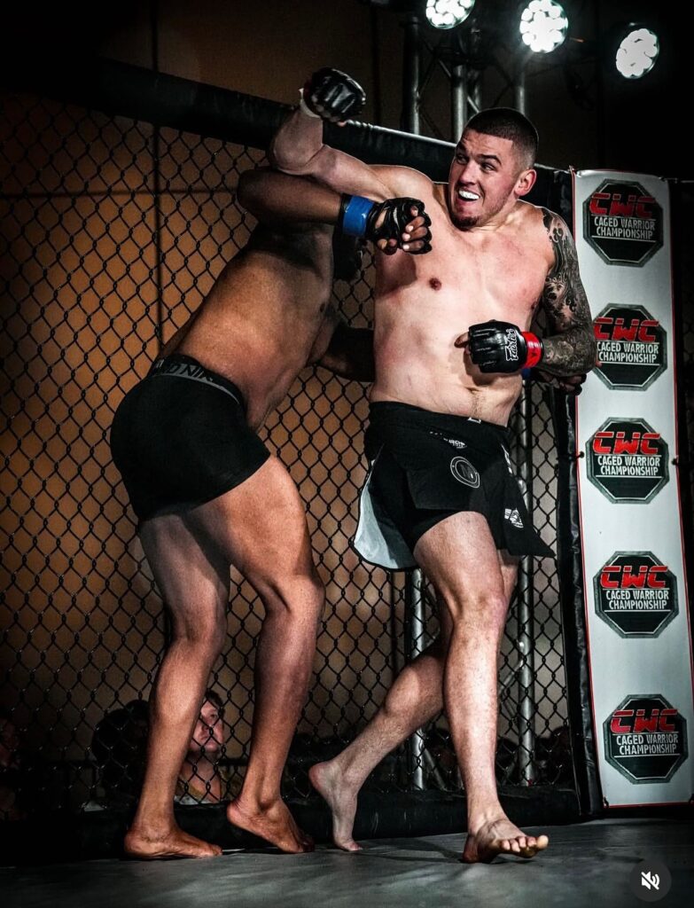 Joe Borkowski lands a decisive elbow against veteran Nick Gay during his professional MMA debut, securing a stoppage victory.