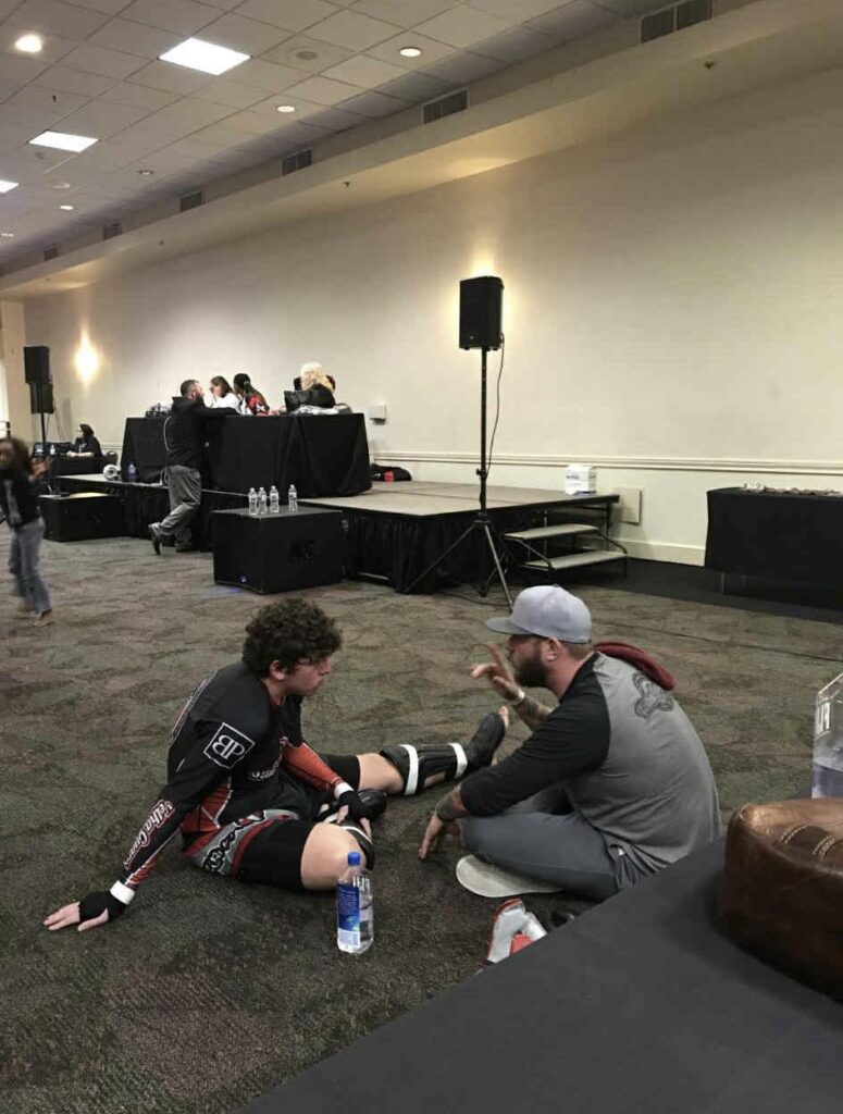 Joe Borkowski as a teenager talking with coach Steve Miller at Louisiana Black Belt Academy in Morgan City, the roots of his journey to headline Thibodaux MMA CWC 38.