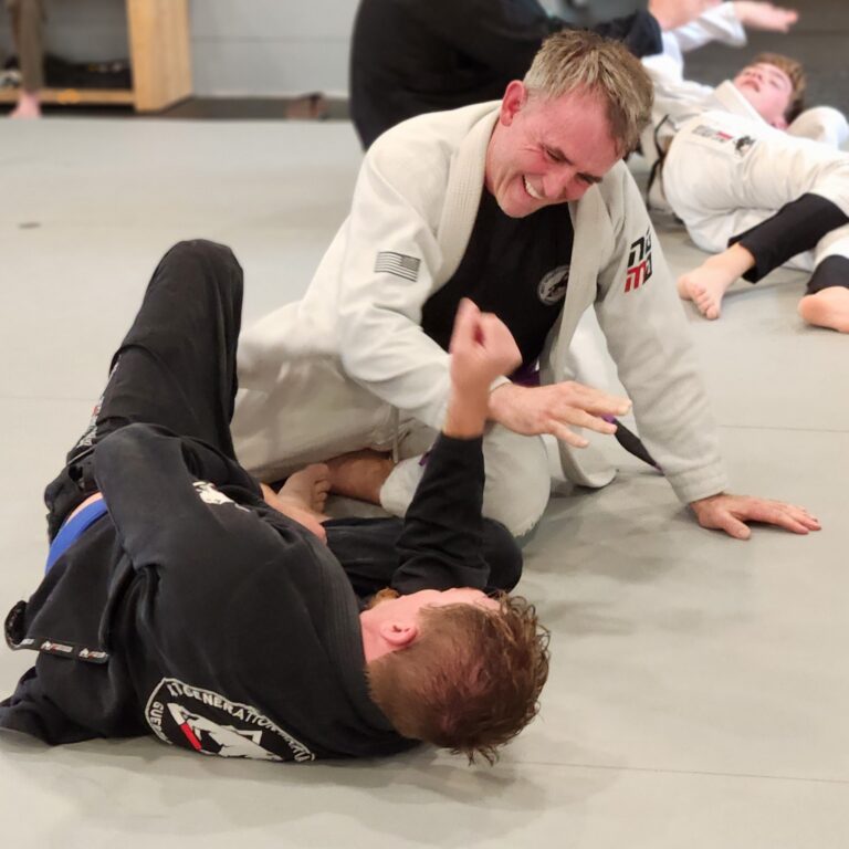 Adult Brazilian Jiu Jitsu students together after training in Thibodaux