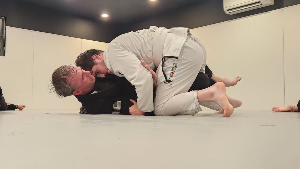 Adult Brazilian Jiu Jitsu students practicing structured positional training in Thibodaux
