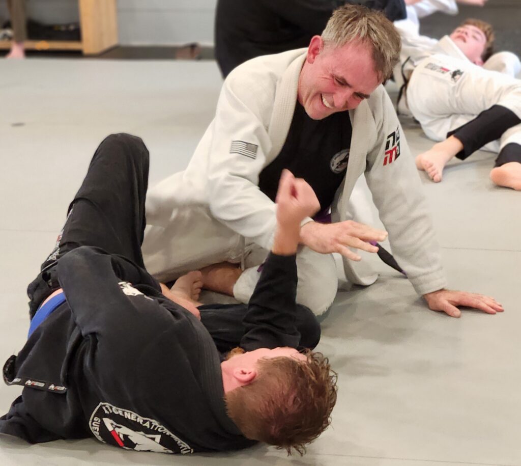 BJJ etiquette in Thibodaux showing respectful training and teamwork on the mat