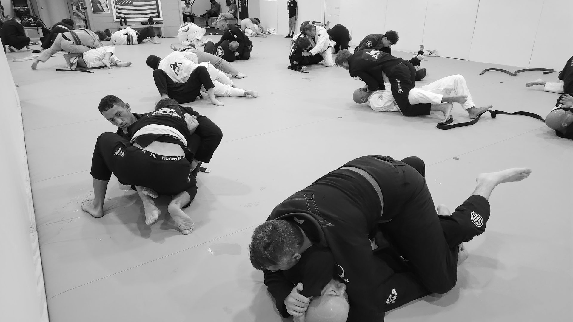 Adults training Brazilian Jiu-Jitsu during a live sparring class at Next Generation Martial Arts in Thibodaux, LA